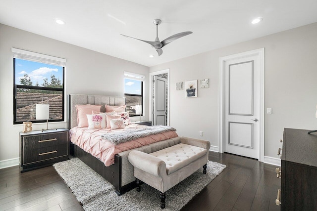 bedroom with ceiling fan and dark hardwood / wood-style flooring