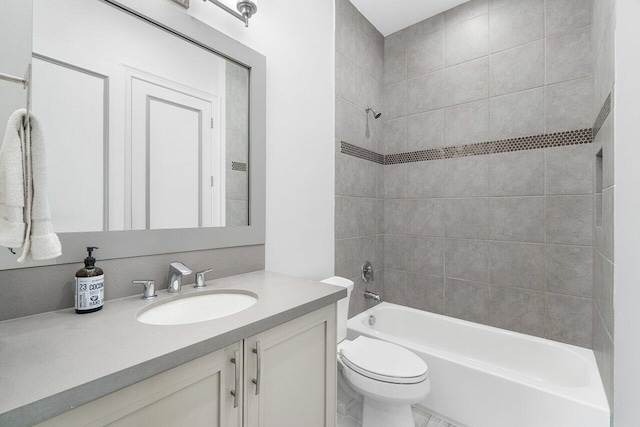 full bathroom with vanity, toilet, and tiled shower / bath combo