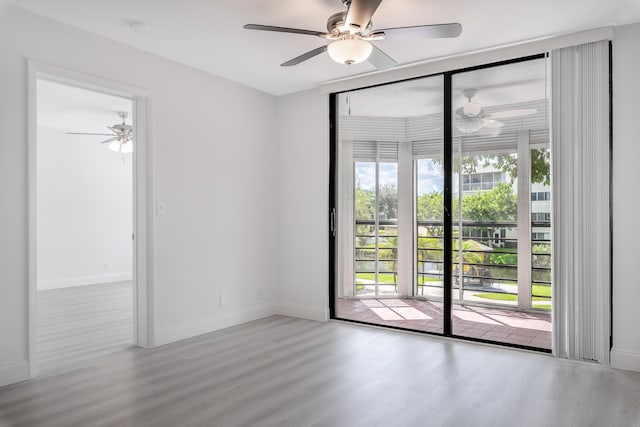 spare room featuring ceiling fan and wood-type flooring