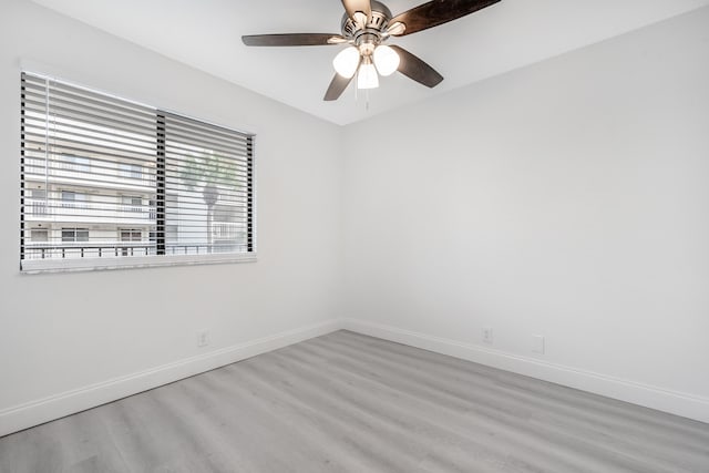 unfurnished room featuring ceiling fan and light hardwood / wood-style flooring