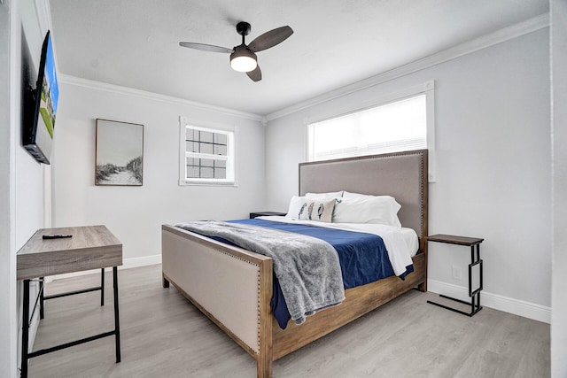 bedroom featuring crown molding, ceiling fan, and light wood-type flooring