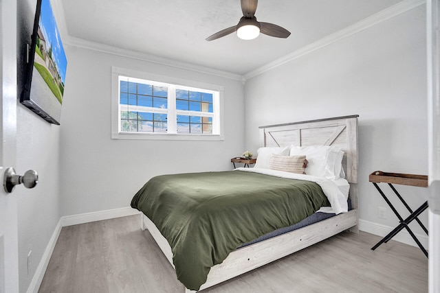 bedroom with ornamental molding, hardwood / wood-style floors, and ceiling fan