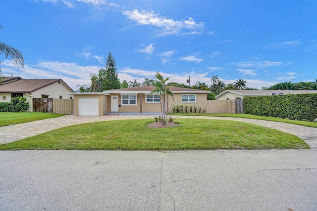 single story home with a garage and a front yard