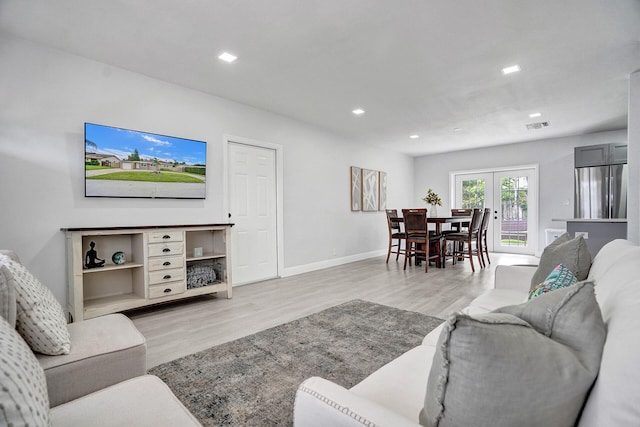 living room with light hardwood / wood-style floors