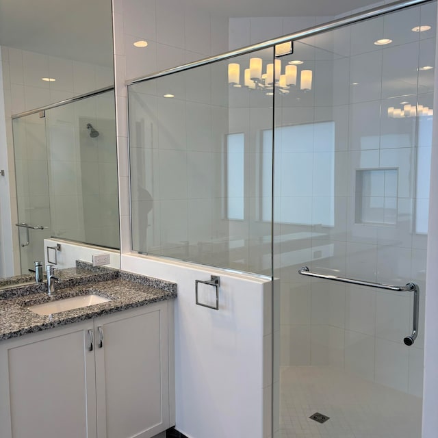 bathroom with vanity and walk in shower