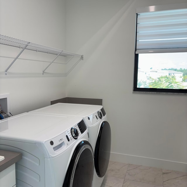 washroom with washer and clothes dryer