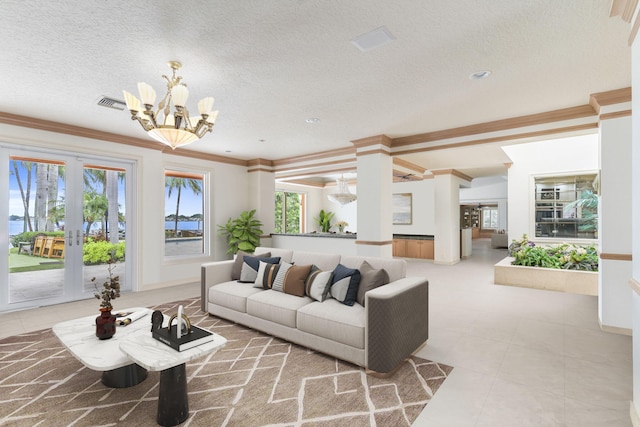 living room featuring a textured ceiling, a notable chandelier, and crown molding