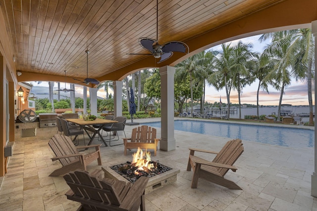 patio terrace at dusk with a fire pit