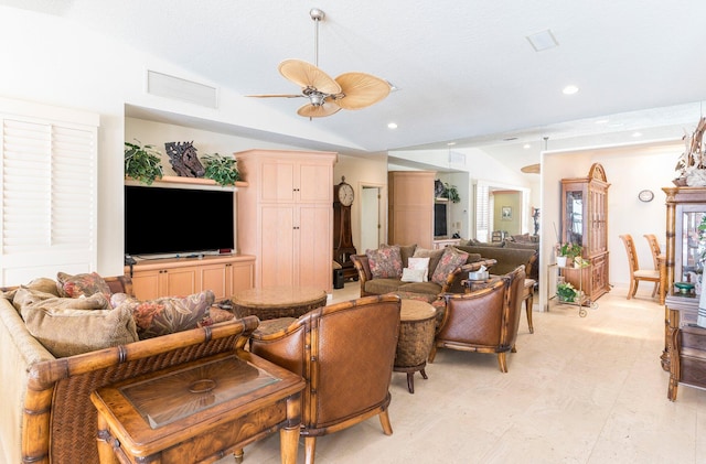 living room featuring a textured ceiling, ceiling fan, and lofted ceiling