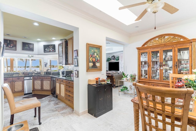 kitchen featuring kitchen peninsula, ceiling fan, crown molding, and stainless steel dishwasher