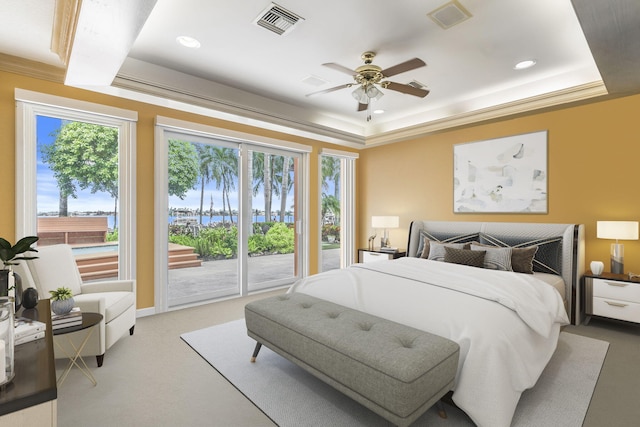 carpeted bedroom featuring access to exterior, a raised ceiling, ceiling fan, and crown molding