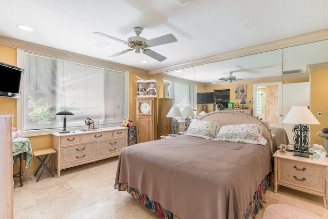 tiled bedroom featuring ceiling fan, crown molding, and a textured ceiling