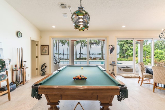 playroom featuring a textured ceiling and pool table