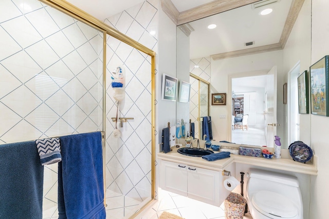 bathroom with tile patterned flooring, toilet, a shower with door, vanity, and ornamental molding