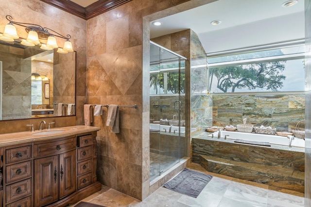 bathroom with plus walk in shower, vanity, tile walls, and crown molding