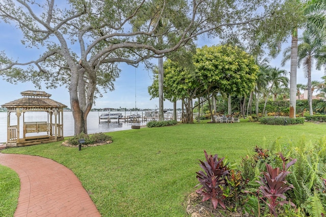 view of yard with a gazebo and a water view