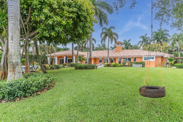 ranch-style house with a front lawn