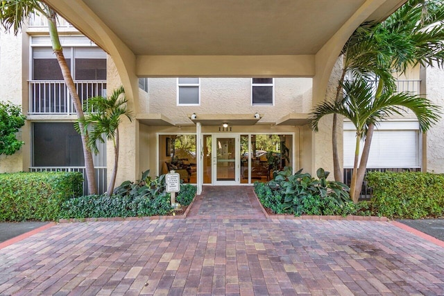 property entrance featuring french doors and a patio