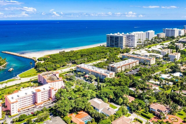 drone / aerial view with a water view and a beach view