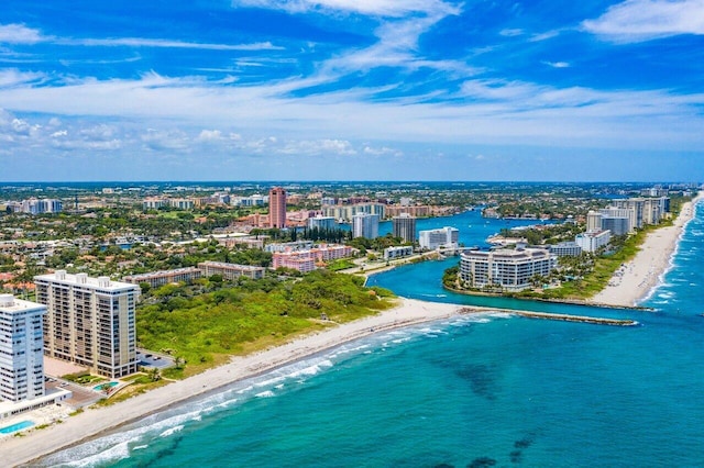 aerial view with a water view and a beach view