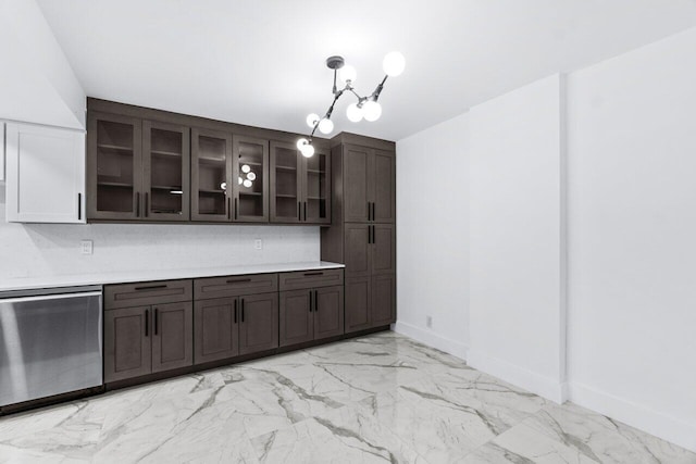 kitchen with a notable chandelier, dark brown cabinetry, and decorative light fixtures