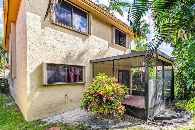 back of property featuring a sunroom