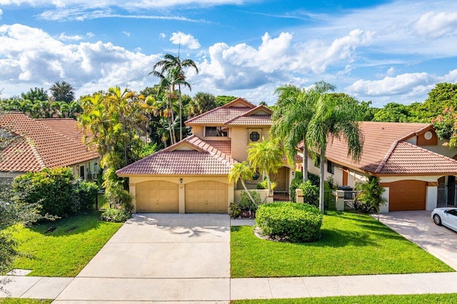 mediterranean / spanish-style home featuring a garage and a front lawn