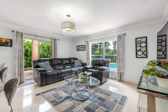 living room with ornamental molding, a healthy amount of sunlight, a textured ceiling, and light tile patterned floors