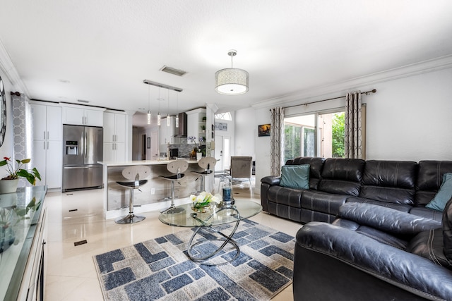 tiled living room featuring crown molding