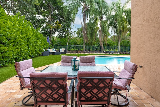 view of pool with a patio and a yard