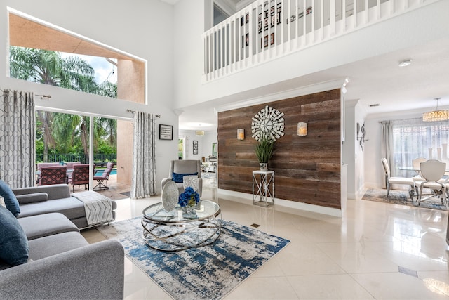 tiled living room featuring a towering ceiling