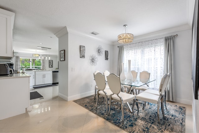 tiled dining room with ornamental molding and a textured ceiling