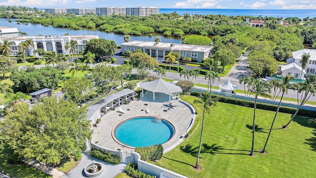 bird's eye view of a large body of water and a pool area