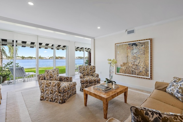 living room featuring a water view and ornamental molding