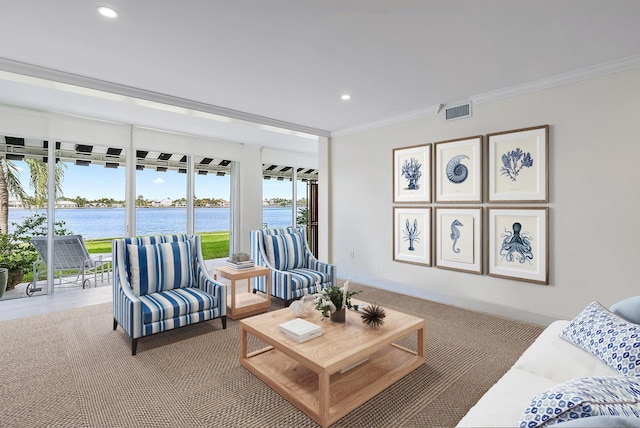 living room featuring ornamental molding and a water view