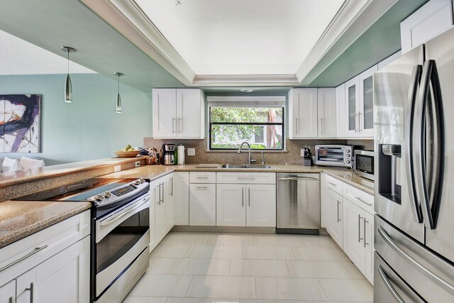 kitchen featuring white cabinets, hanging light fixtures, ceiling fan, and stainless steel electric stove