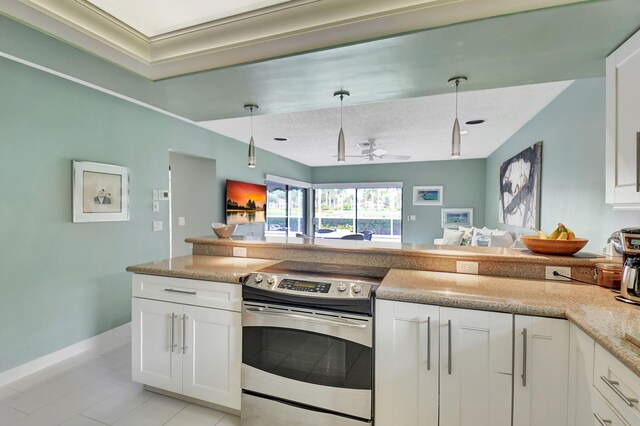 kitchen featuring a wealth of natural light, kitchen peninsula, and stainless steel range with electric stovetop