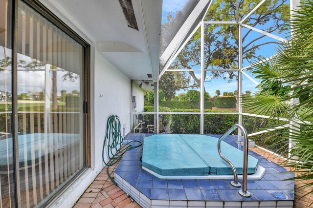 view of swimming pool featuring a patio, area for grilling, and a lanai