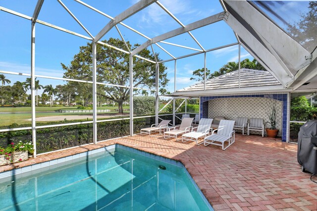 view of pool featuring a lanai and a patio area