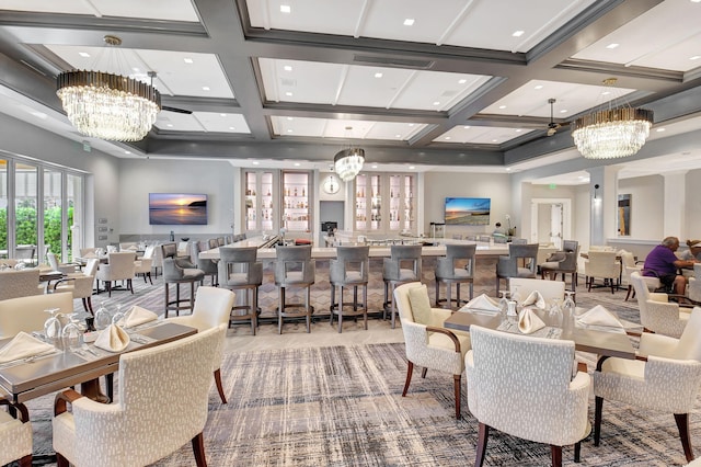 dining area with beam ceiling and coffered ceiling