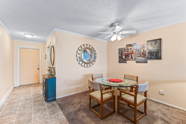 carpeted dining space featuring ceiling fan, crown molding, and a textured ceiling