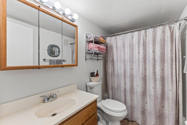 2950 SE Ocean Blvd Unit 38-2, Stuart, FL 34996 - full bath with visible vents, toilet, a shower with curtain, and vanity