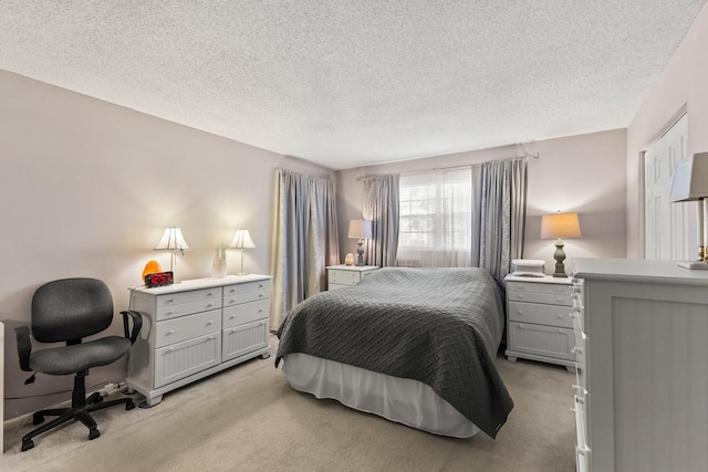 2950 SE Ocean Blvd Unit 38-2, Stuart, FL 34996 - bedroom featuring a textured ceiling and light carpet