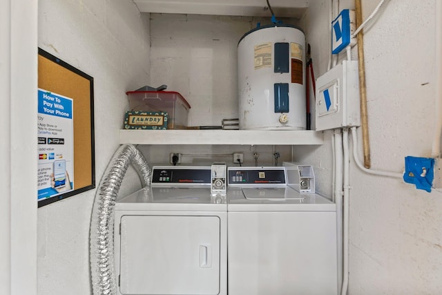 2950 SE Ocean Blvd Unit 38-2, Stuart, FL 34996 - laundry area with water heater and washing machine and dryer