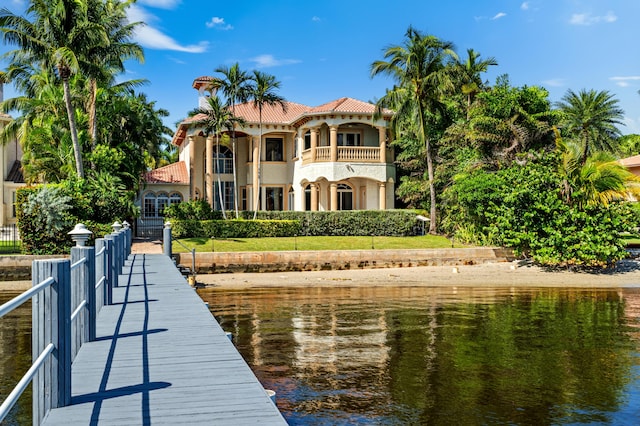 view of dock with a water view and a balcony