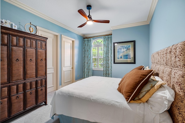 bedroom featuring ornamental molding, light carpet, and ceiling fan