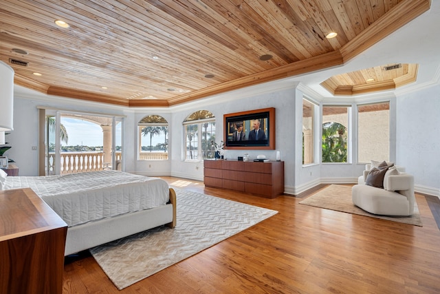 bedroom with wood ceiling, a raised ceiling, ornamental molding, and hardwood / wood-style floors