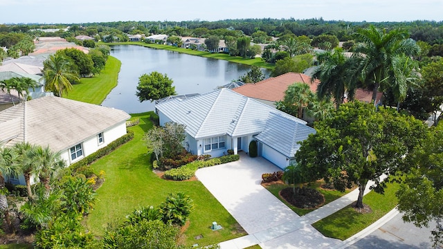 birds eye view of property with a water view