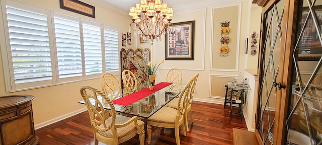 dining area featuring dark hardwood / wood-style flooring, an inviting chandelier, and ornamental molding