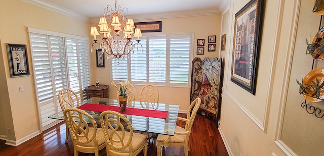 dining room with a chandelier, dark hardwood / wood-style flooring, and crown molding